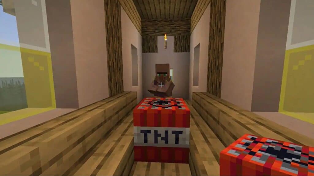 Un aldeano de Minecraft frente a un bloque de TNT
