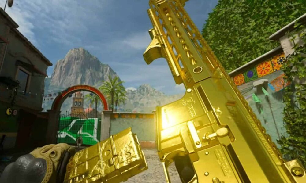 modern warfare 2 player holding up golden gun camo