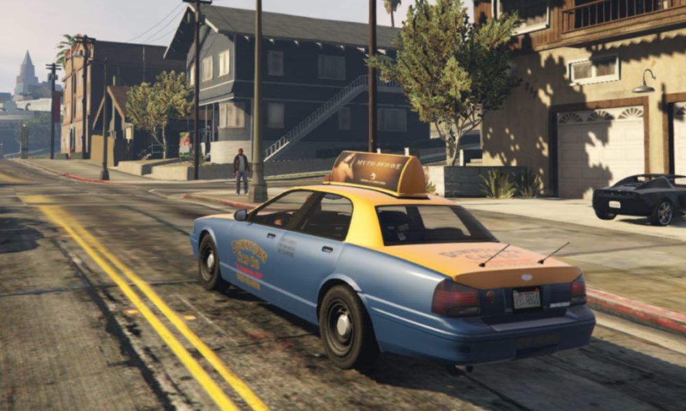 gta online taxi cab driving down road