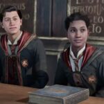 Two Hogwarts Legacy characters sitting next to each other