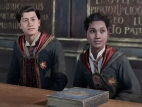 Two Hogwarts Legacy characters sitting next to each other