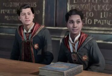 Two Hogwarts Legacy characters sitting next to each other