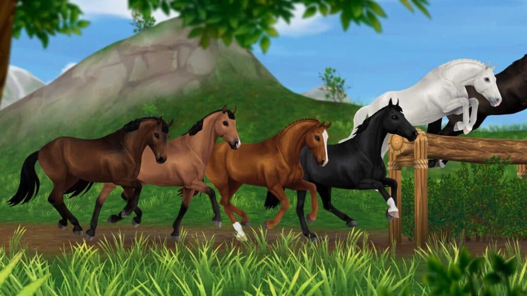 Caballos de Star Stable cruzando una valla