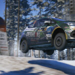 Car flying in a snow track in EA Sports WRC