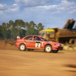 Mitsubishi Lancer Evo racing in dirt track in EA Sports WRC