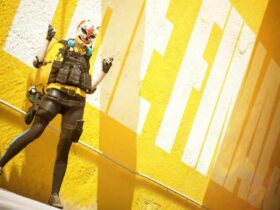 The Finals character standing in front of yellow wall.