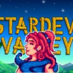 Sandy in front of a stardew valley poster